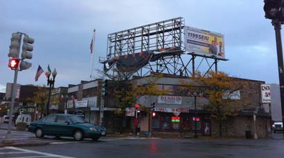Billboard damaged in Adams Corner: Sandy's winds blew off an ad atop this building.